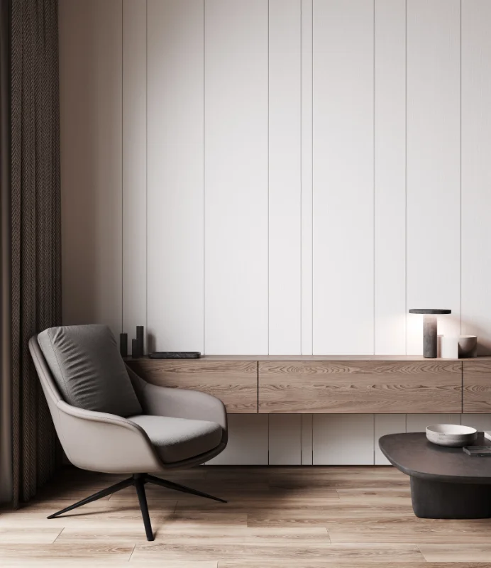 reformas integrales en Sarrià - Sant Gervasi - Detalle minimalista de sillón, mesita y cajonera de pared - Grupo AyM